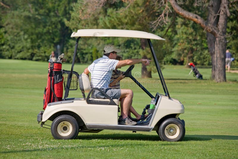 A Father and Son in Golf Cart. A Father and Son in Golf Cart