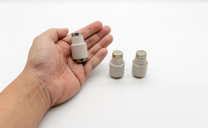 Fuse cup, ceramic fuse, vintage fuse on white royalty free stock images.
