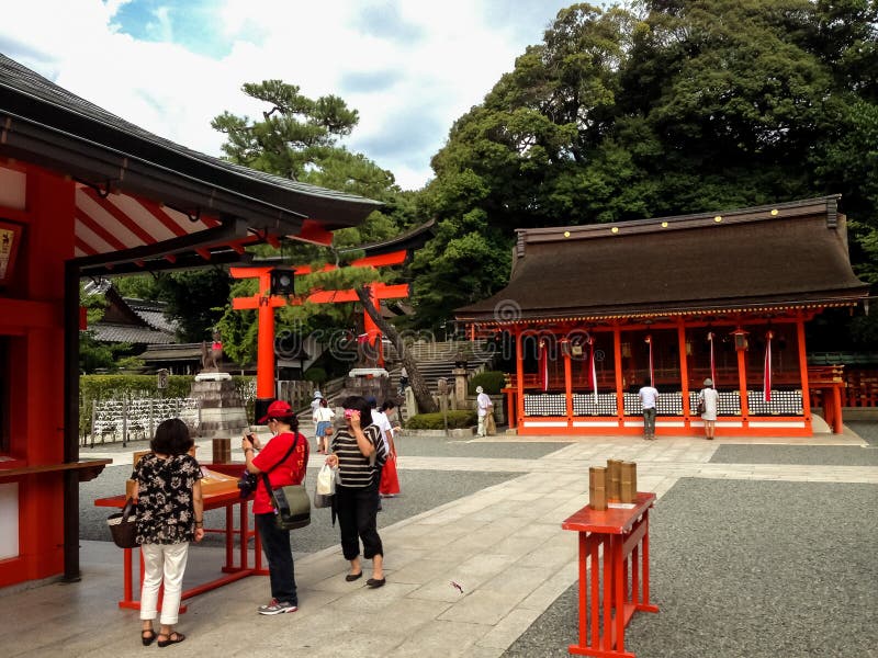 Unidentified people at Fushimi Inari taisha shrine in Kyoto, Japan. This popular shrine is said to have as many as 32,000 sub-shrines throughout Japan. Unidentified people at Fushimi Inari taisha shrine in Kyoto, Japan. This popular shrine is said to have as many as 32,000 sub-shrines throughout Japan