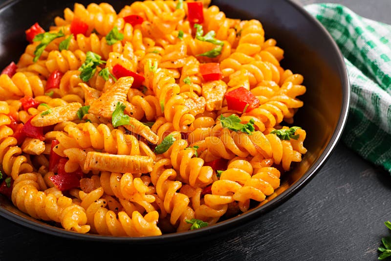 Fusilli Pasta with Chicken and Sweet Pepper in Tomato Sauce Stock Photo ...