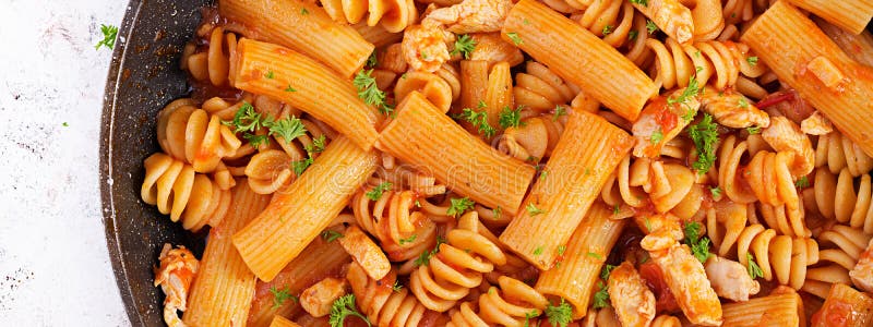 Fusilli Pasta in Tomato Sauce with Chicken, Tomatoes Decorated with ...