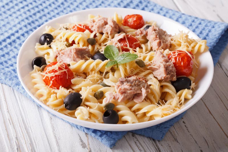 Fusilli Pasta with Tuna, Tomatoes and Parmesan on the Table. Hor Stock