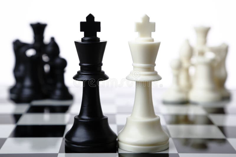 Chess pieces on a chessboard indicating merger and acquisition with white background. Chess pieces on a chessboard indicating merger and acquisition with white background