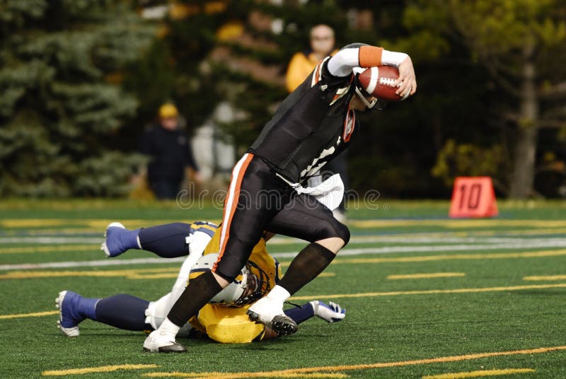 American football players in the game. Canadian University league. All logos remloved. American football players in the game. Canadian University league. All logos remloved