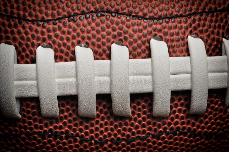 American football close up with laces and texture. American football close up with laces and texture