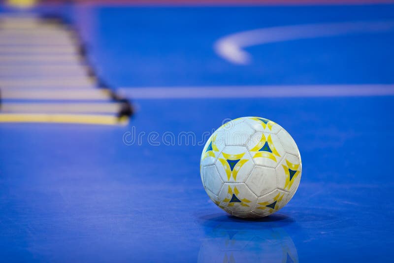 Futsal Ball on Blue Indoor Field. Blue Futsal Training Pitch. stock photos