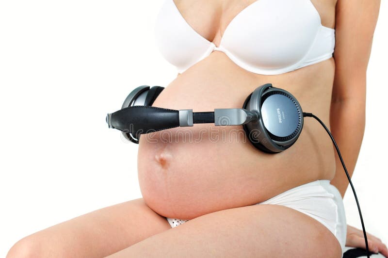 Concept Pregnancy and Music. Belly of Pregnant Woman and Headphones Stock  Image - Image of hand, life: 28234133