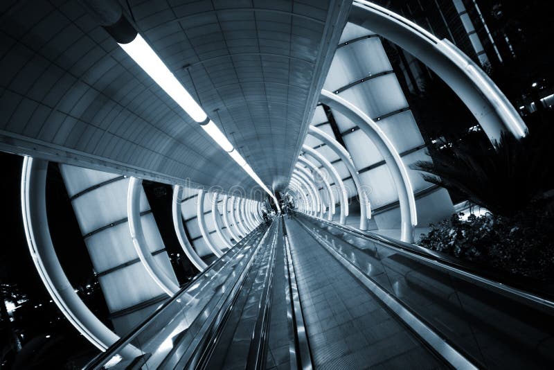 Futuristic architecture. Tunnel with moving sidewalk.