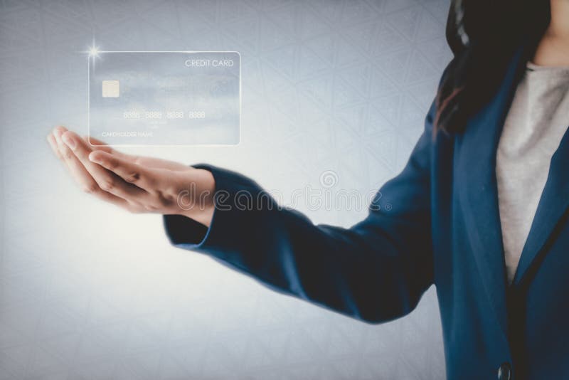 Futuristic Credit Card Banking and Business Financial Concept, Business Woman Holding Electronic Virtual Credit Card for Customer.