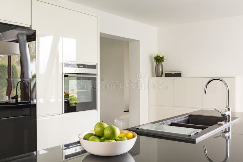 Futuristic high gloss kitchen royalty free stock photography