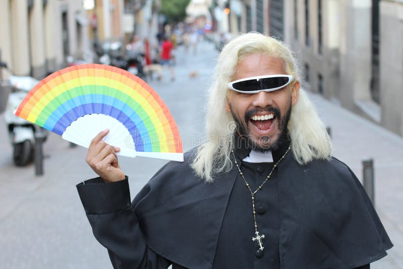 Futuristic Looking Priest Holding a Rainbow Fan Stock Image