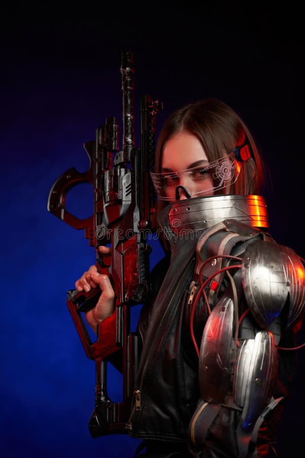 Futuristic woman with eyewear and rifle in dark blue background