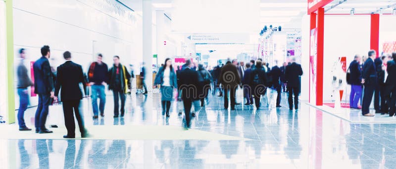 Concept of futuristic business people at an expo hall. Concept of futuristic business people at an expo hall