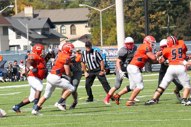 Schneider Field, Carroll University, Waukesha, WI, USA, Sep 27, 2014. 2014 Midwest Conference DIV III Football, Carroll University versus Monmouth University. Final Carroll 32, Monmouth 27. Carroll #65 and 59 double team their opponent. Schneider Field, Carroll University, Waukesha, WI, USA, Sep 27, 2014. 2014 Midwest Conference DIV III Football, Carroll University versus Monmouth University. Final Carroll 32, Monmouth 27. Carroll #65 and 59 double team their opponent.