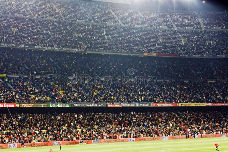 Joy fans after scoring the goal of their favorite team. Photo taken during the soccer match FC Barcelona vs Athletico Billbao 03.04.2010 on Camp Nou statium in Barcelona. Joy fans after scoring the goal of their favorite team. Photo taken during the soccer match FC Barcelona vs Athletico Billbao 03.04.2010 on Camp Nou statium in Barcelona