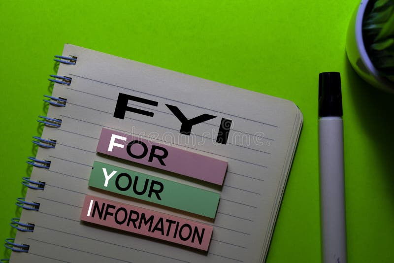FYI. For Your Information acronym on sticky notes. Office desk background