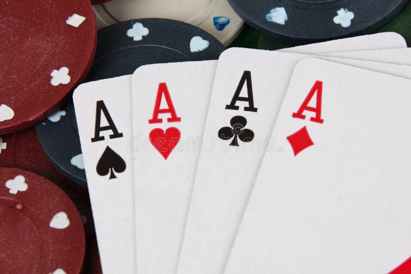 Four aces winning hand on a pile of betting casino chips. Four aces winning hand on a pile of betting casino chips