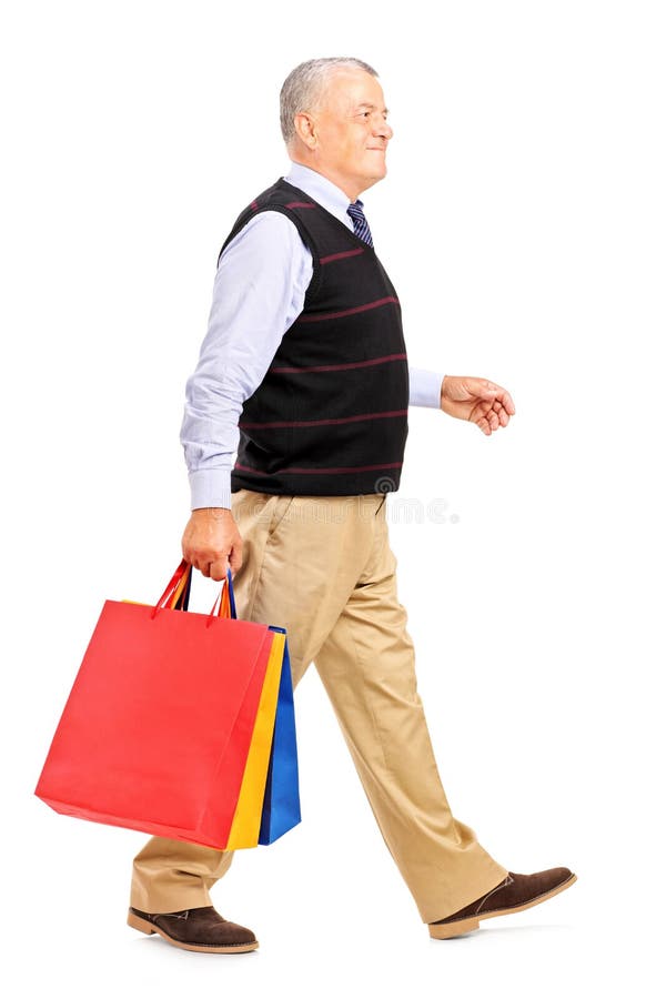 Full length portrait of a mature man coming back after shopping on white background. Full length portrait of a mature man coming back after shopping on white background