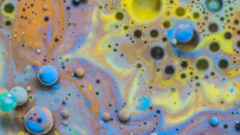 Waterpaint and oil mixing experiments. Magic, colourful and beautiful effect. Color Bubbles in the abstract environment. Waterpaint and oil mixing experiments. Magic, colourful and beautiful effect. Color Bubbles in the abstract environment