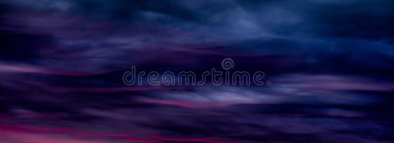 Colorful sunset with clouds in the evening. Abstract nature background. Dramatic and moody pink, purple and blue cloudy sunset sky. Colorful sunset with clouds in the evening. Abstract nature background. Dramatic and moody pink, purple and blue cloudy sunset sky.