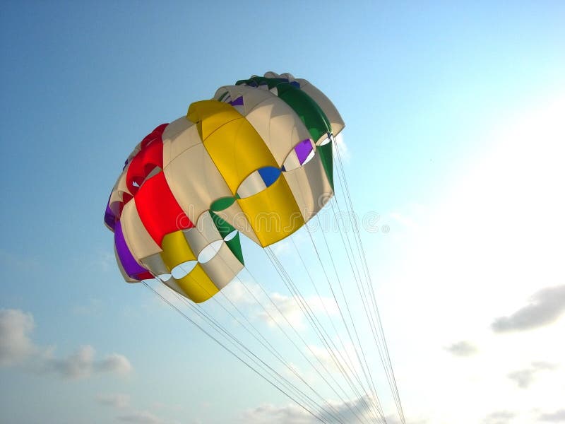 Colorful para sailing balloon sours high in the sky. Colorful para sailing balloon sours high in the sky.