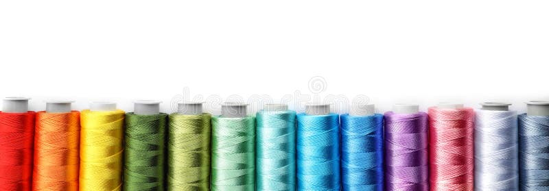 Color sewing threads on white background, top view. Color sewing threads on white background, top view