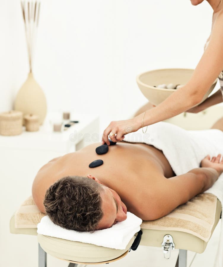 Young man enjoying the treatment in spa salon. Young man enjoying the treatment in spa salon