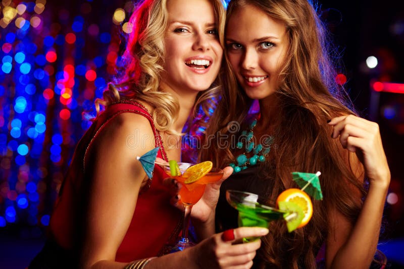 Image of happy girls looking at camera at party. Image of happy girls looking at camera at party