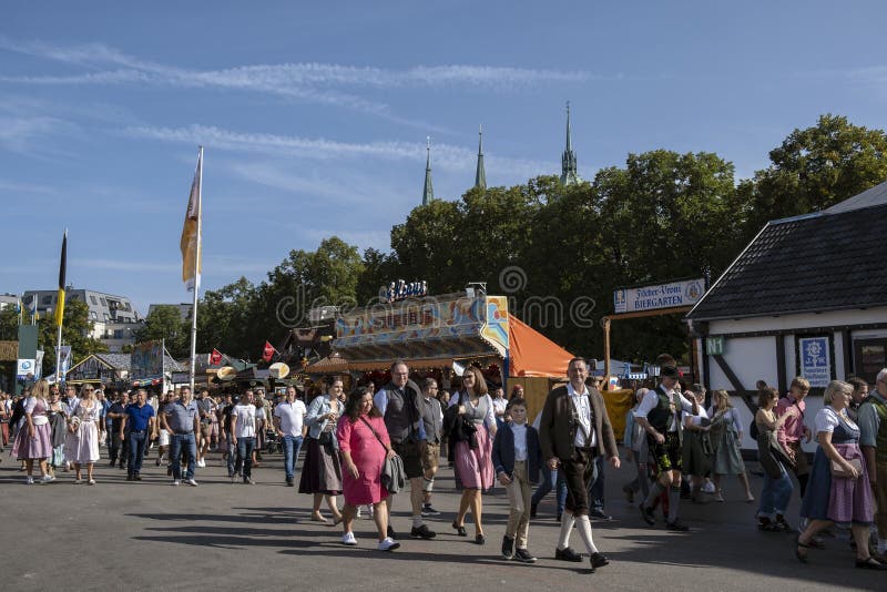 Munich, Germany - October 1, 2023. People at Oktoberfest 2023, the world-famous beer festival in the Bavarian culture called d' Wiesn, in Munich, Deutschland. Munich, Germany - October 1, 2023. People at Oktoberfest 2023, the world-famous beer festival in the Bavarian culture called d' Wiesn, in Munich, Deutschland.