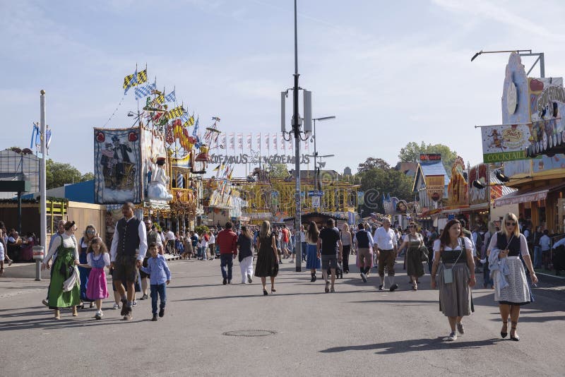 Munich, Germany - October 1, 2023. People at Oktoberfest 2023, the world-famous beer festival in the Bavarian culture called d' Wiesn, in Munich, Deutschland. Munich, Germany - October 1, 2023. People at Oktoberfest 2023, the world-famous beer festival in the Bavarian culture called d' Wiesn, in Munich, Deutschland.