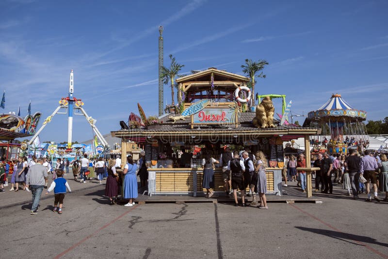 Munich, Germany - October 1, 2023. People at Oktoberfest 2023, the world-famous beer festival in the Bavarian culture called d' Wiesn, in Munich, Deutschland. Munich, Germany - October 1, 2023. People at Oktoberfest 2023, the world-famous beer festival in the Bavarian culture called d' Wiesn, in Munich, Deutschland.