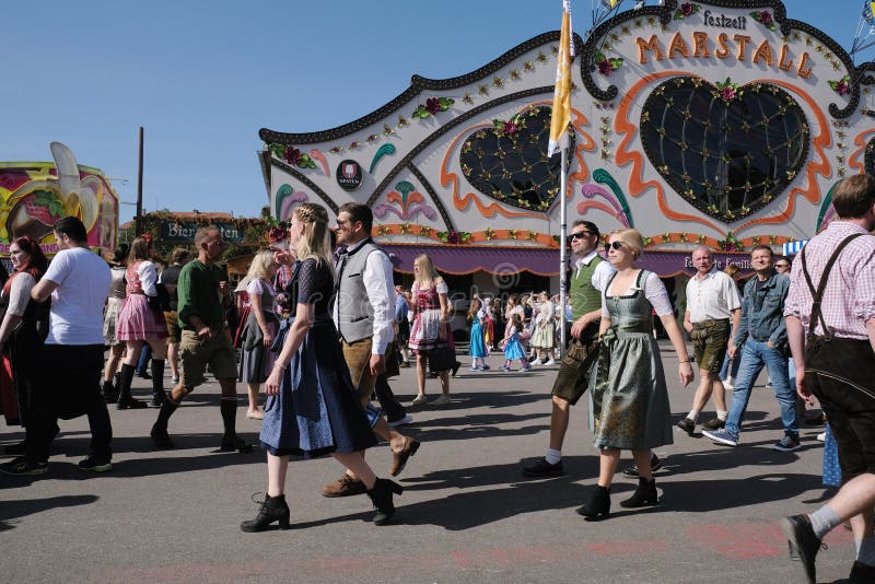 Munich, Germany - October 1, 2023. People at Oktoberfest 2023, the world-famous beer festival in the Bavarian culture called d' Wiesn, in Munich, Deutschland. Munich, Germany - October 1, 2023. People at Oktoberfest 2023, the world-famous beer festival in the Bavarian culture called d' Wiesn, in Munich, Deutschland.