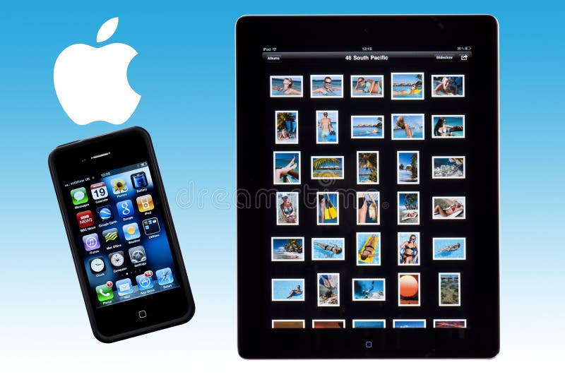 An Apple ipad 2 and iphone 4S with the Apple logo. An Apple ipad 2 and iphone 4S with the Apple logo.