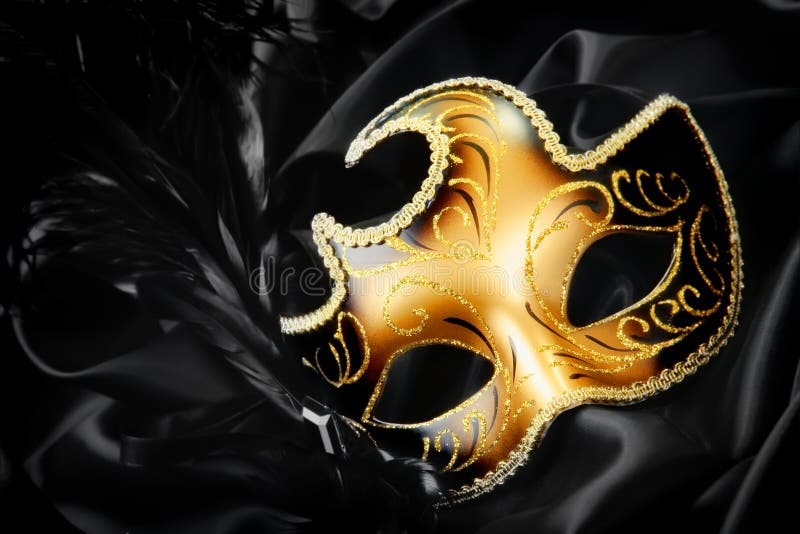 Ornate carnival mask on black silk background. Ornate carnival mask on black silk background.