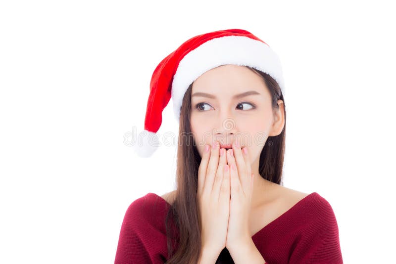 För kvinnakläder för stående ung asiatisk santa hatt med förvånat arkivbilder För kvinnakläder för stående ung asiatisk santa hatt med förvånat arkivbilder