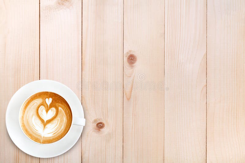 För lattekonst för bästa sikt kaffe på wood bakgrund royaltyfri bild