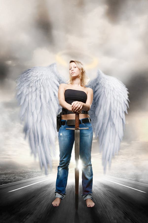 Beautiful young woman posing as majestic angel guardian. Beautiful young woman posing as majestic angel guardian