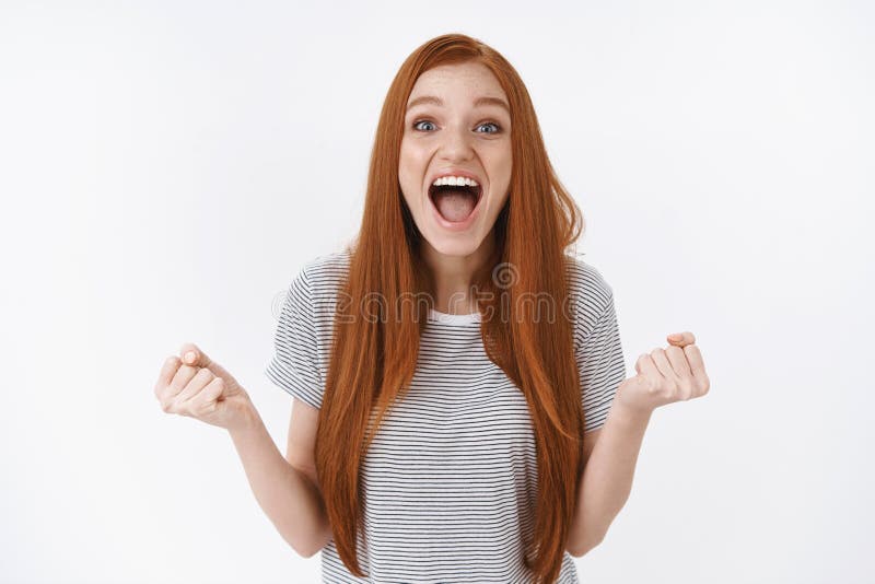 Happy impressed excited cute redhead female college student win first prize screaming surprised clench fists joyfully celebrate success gain victory triumphing smiling cheerful, white background. Happy impressed excited cute redhead female college student win first prize screaming surprised clench fists joyfully celebrate success gain victory triumphing smiling cheerful, white background.