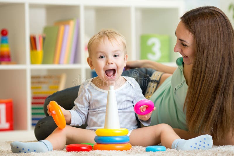 Parent and child boy play together at home. Parent and child boy play together at home