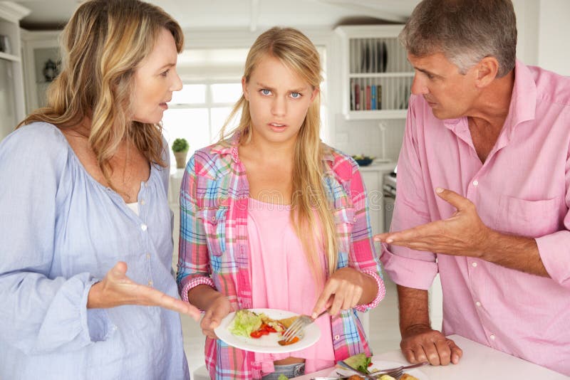 Parents making teenage daughter do chores at home making hand gestures. Parents making teenage daughter do chores at home making hand gestures