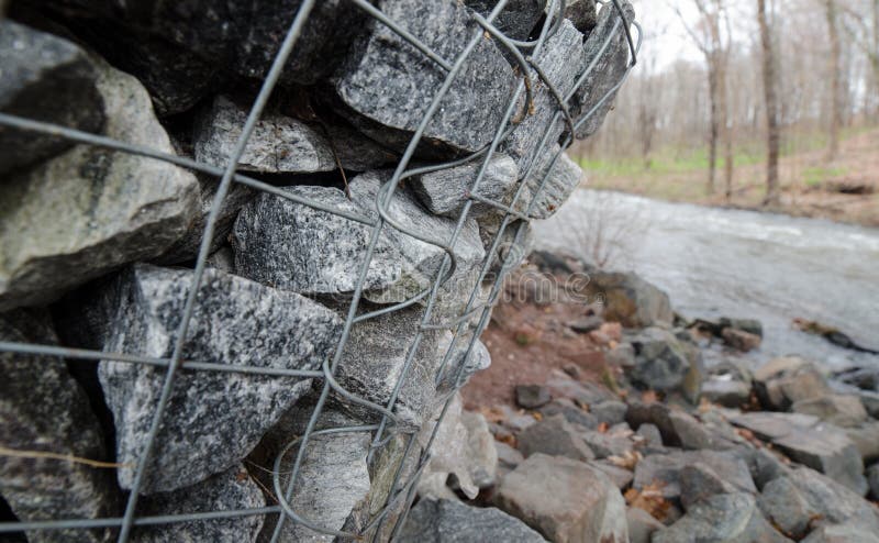 Gabion boxes protecting a river from erosion