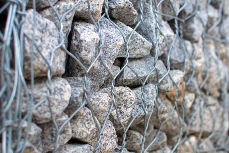 Gabion stone wall close-up, selective focus