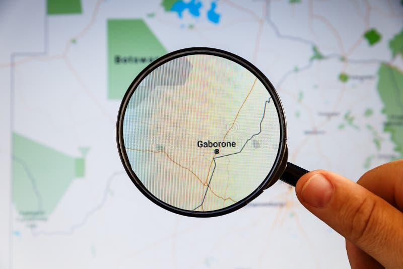 Gaborone, Botswana. Political map. City visualization illustrative concept on display screen through magnifying glass in the hand. Botswana political map stock images, royalty-free photos and pictures
