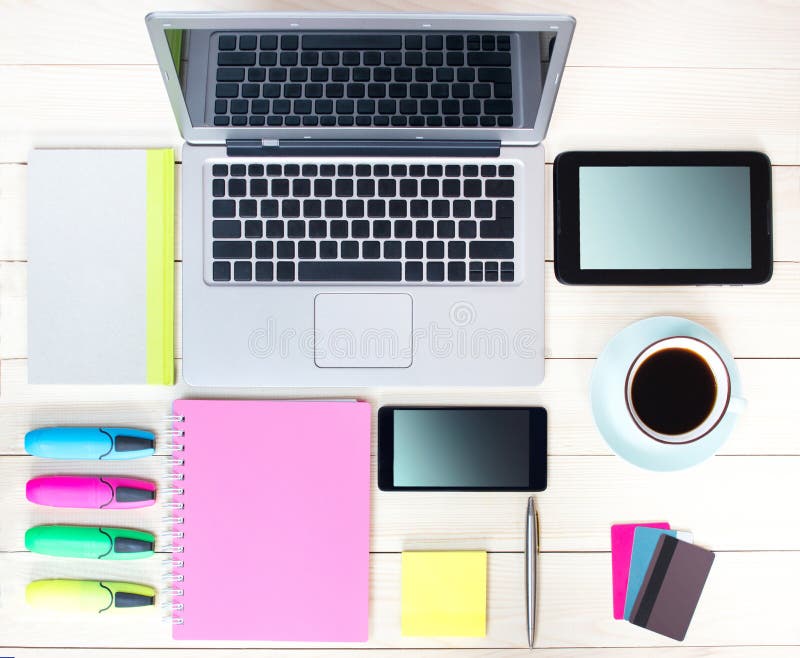 Gadgets on wooden background.Workplace upper view.