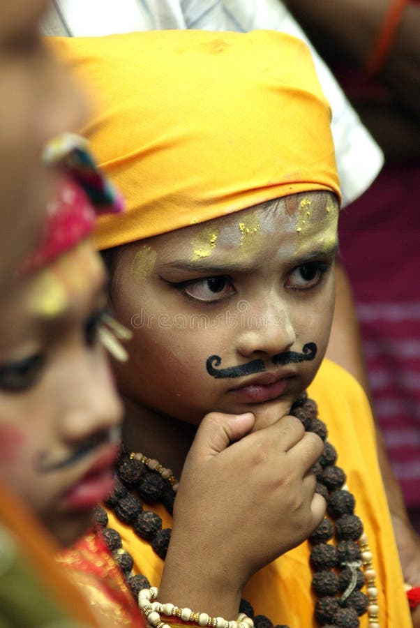 A small boy in Gaijatra Festival.Gai Jatra is a festival celebrated by the Newar community of Kathmandu valley every year since the malla period. Every family who lost their member participate in this festival. They bring children or sometimes adult as well with resemblance of Radha Krishna or give them funny looks or resemblance of cow, yogi and other Hindu idol. Gai Jatra is a healthy festival which enables the people to accept the reality of death and to prepare oneself for the life after death. A small boy in Gaijatra Festival.Gai Jatra is a festival celebrated by the Newar community of Kathmandu valley every year since the malla period. Every family who lost their member participate in this festival. They bring children or sometimes adult as well with resemblance of Radha Krishna or give them funny looks or resemblance of cow, yogi and other Hindu idol. Gai Jatra is a healthy festival which enables the people to accept the reality of death and to prepare oneself for the life after death.