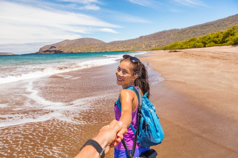 Galapagos tourists having fun on travel on Espumilla Beach, Santiago, Galapagos royalty free stock photos Galapagos tourists having fun on travel on Espumilla Beach, Santiago, Galapagos royalty free stock photos