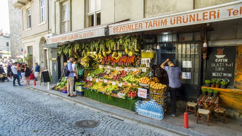 Street life under the Galata tower Galata-Karaköy quarter of Istanbul, Turkey. 06-22-2019. Fruit and vegetable shop. Street life under the Galata tower Galata-Karaköy quarter of Istanbul, Turkey. 06-22-2019. Fruit and vegetable shop