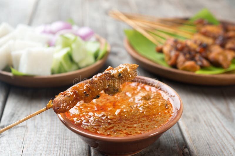 Malaysian chicken satay with delicious peanut sauce, one of famous local dishes. Malaysian chicken satay with delicious peanut sauce, one of famous local dishes.