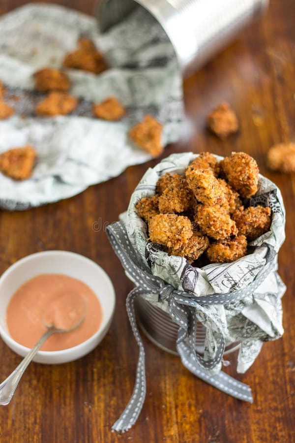 Chicken pieces coated in breadcrumbs and served with dip. Chicken pieces coated in breadcrumbs and served with dip.