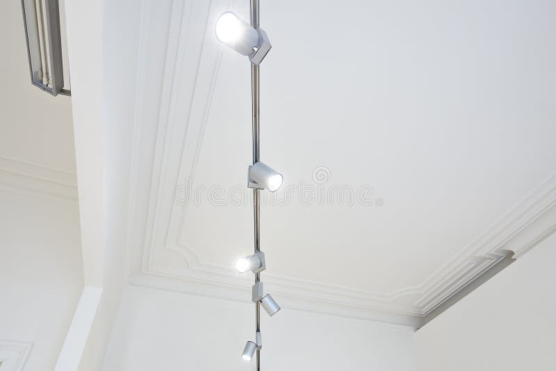 Gallery light spot illuminated on white ceiling stock photos